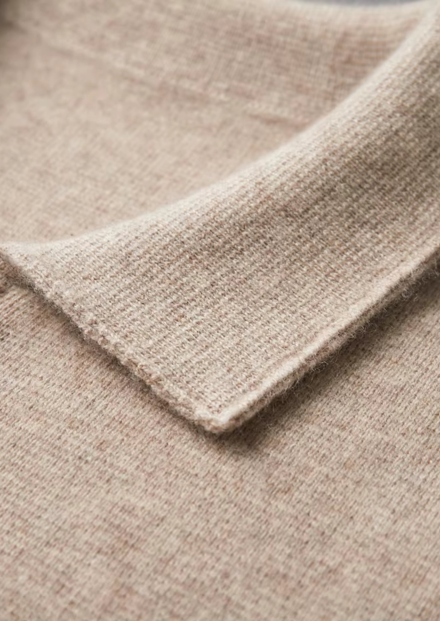 Polo zippé en laine mérinos extra-fine