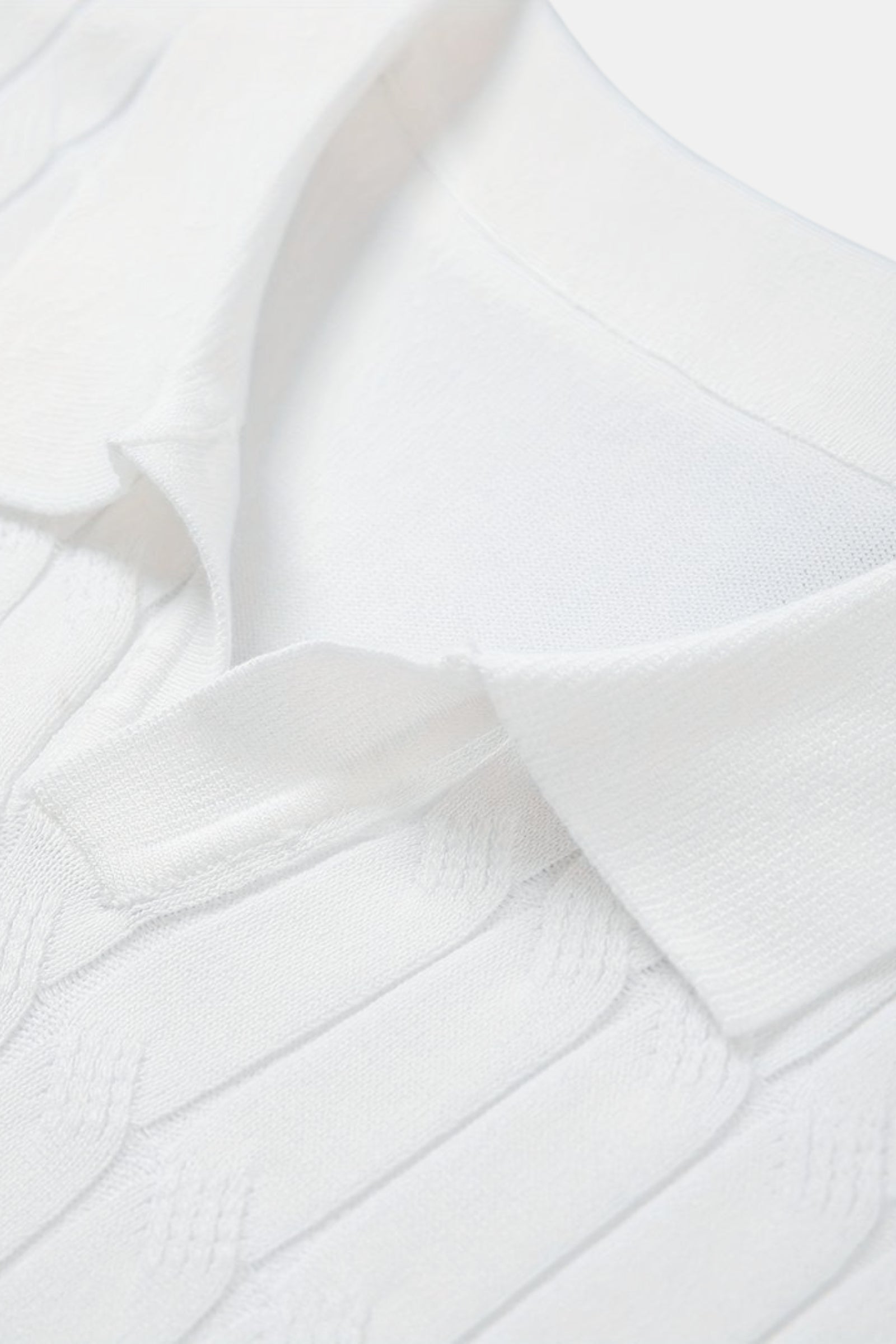 Polo Premium à col en V et tricot torsadé